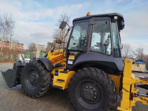 Żółta koparko-ładowarka